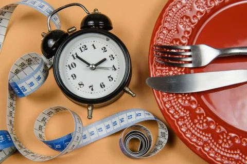 Dish with alarm clock inside Stock-Fotos