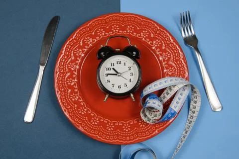 Dish with alarm clock inside Foto stock