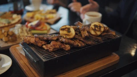 Dish of assorted roasted meat on the grill Stock Footage 91222194