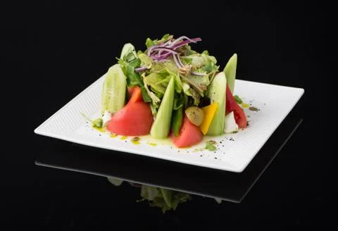 Dish on black background Stock Photos