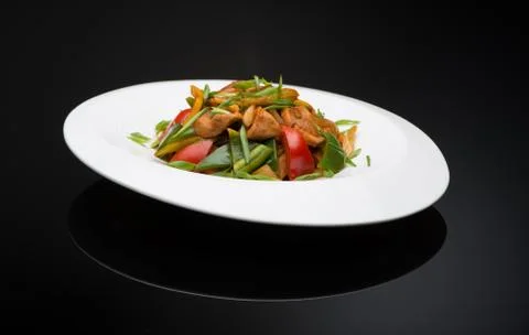 Dish on black background Stock Photos