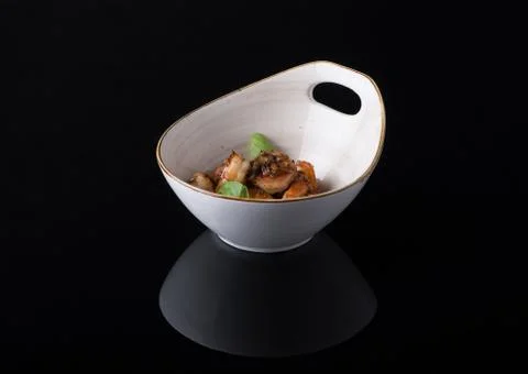 Dish on black background Stock Photos
