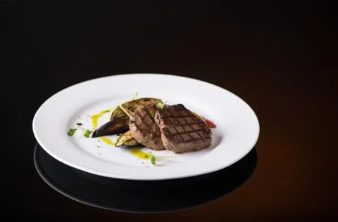 Dish on black background Stock Photos