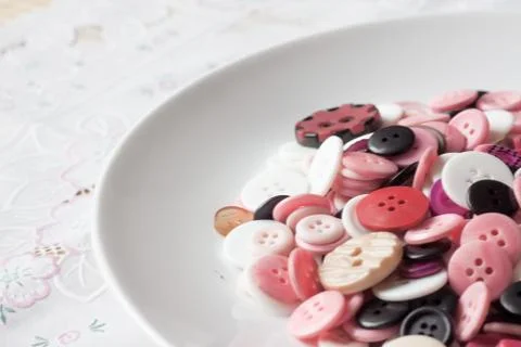 Dish of buttons Foto stock