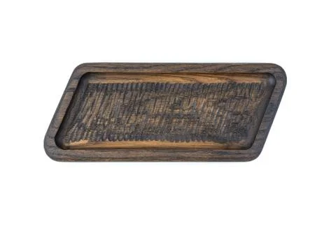 The dish is carved from natural solid oak, brown color on a white background Stock Photos