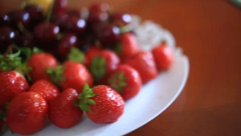 Dish with cherries and strawberries close-up Stock Footage 76864313