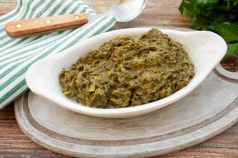 Dish of chopped spinach with cream Stock Photos