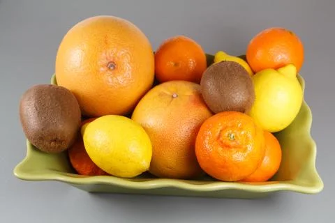 Dish of citrus on a table Stock Photos