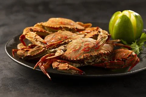 Dish of cooked crabs on the table. Stock Photos