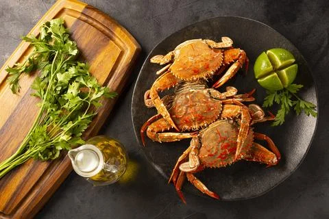 Dish of cooked crabs on the table. Stock Photos