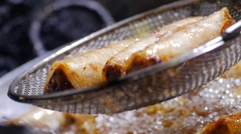 Dish is deep-fried in the Vietnamese market 2 스톡 동영상 64570865