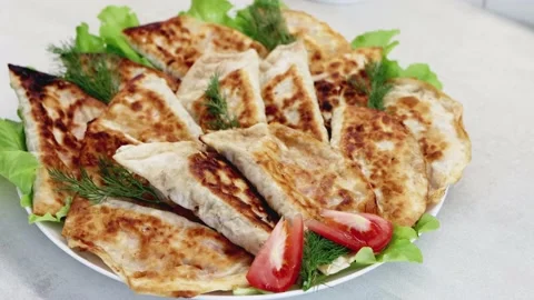 Dish with delicious fried chebureks made from dough and minced meat. Homemade Video stock 217669926