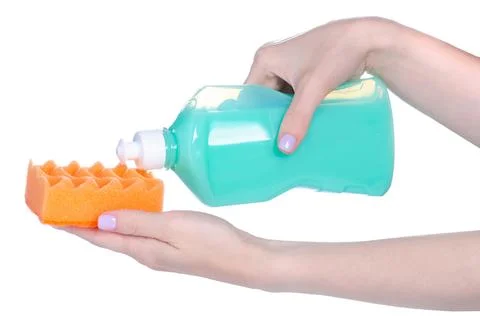 Dish detergent with clean sponge in hand Stock Photos