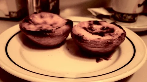 Dish with the famous pasteis de nata, typical dessert of Lisbon, Portugal Stock Footage 109379877