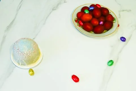 A dish filled with brightly colored eggs and Easter Cake Stock Photos