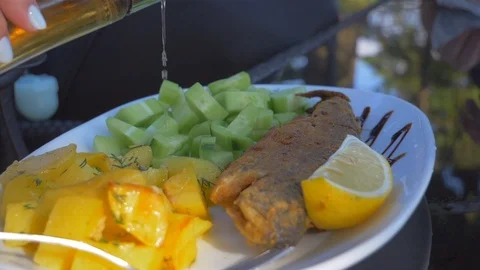 Dish with fish and vegetable garnish Video stock 112029490