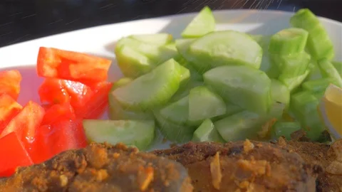 Dish with fish and vegetable garnish Video stock 112029702