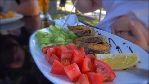 Dish with fish and vegetable garnish Stock Footage 112029761