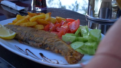 Dish with fish and vegetable garnish Video stock 112029933