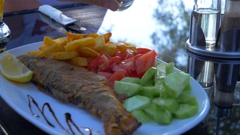 Dish with fish and vegetable garnish Video stock 112029979
