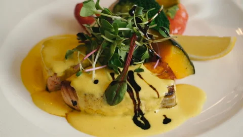 Dish with fish. Fish Dish Sauce Poured Stock Footage 108818083