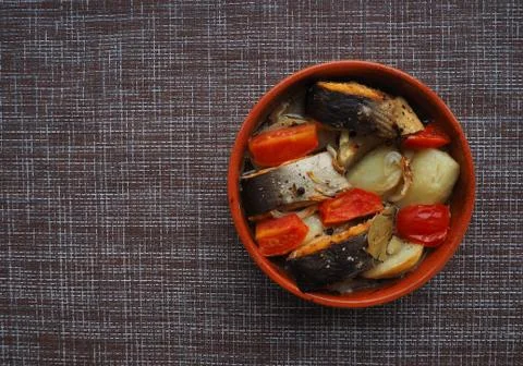 A dish of fish with vegetables. Stock Photos