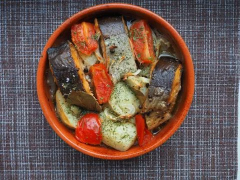 A dish of fish with vegetables. Stock Photos
