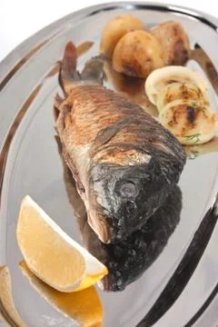 Dish of fried fish Stock Photos
