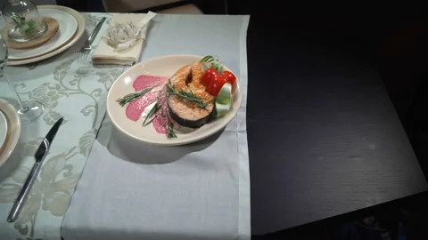 Dish fried red fish steak in a restaurant Vídeo Stock 103399550
