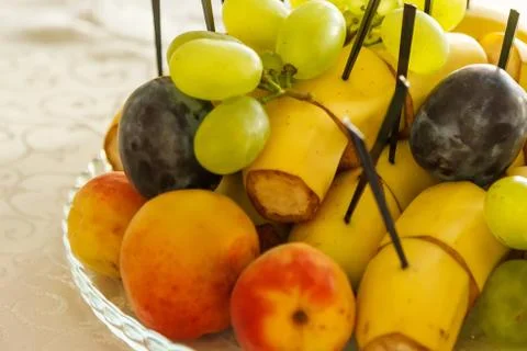 Dish with fruit on the festive table 스톡 사진