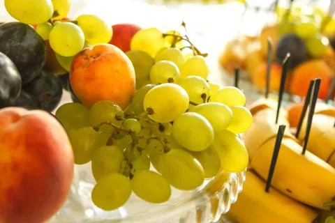 Dish with fruit on the festive table 스톡 사진