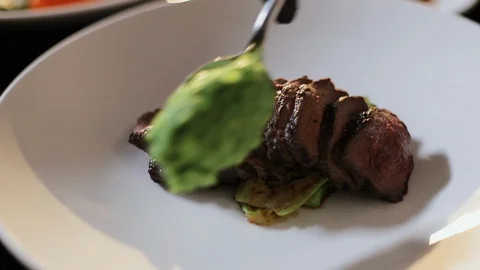 Dish On Large White Plate. Chef Puts Spoonful Of Green Smoothie On Plate. Sliced Stock Footage 120574774