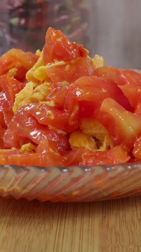 Dish made with tomato and egg. Steaming hot tomato egg cuisine. Stock Footage 341306387