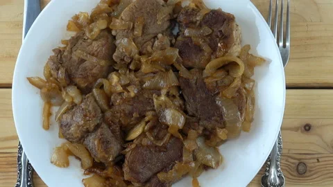 Dish with meat on a wooden table Stock Footage 129192723