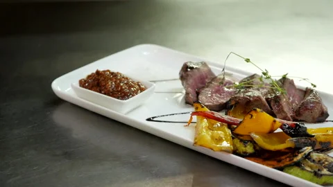 A Dish of Medium Rare Veal with Vegetables Video stock 132217102