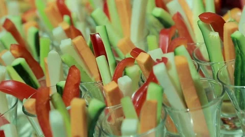 A dish of peppers, cucumbers, glasses with sliced vegetables Stock Footage 56574853