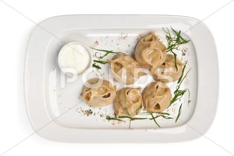 Dish of ravioli with sour cream Stock Photos
