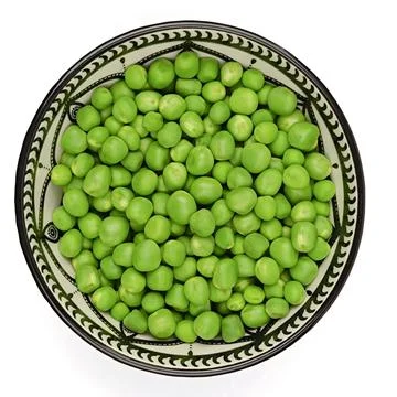 Dish of raw peas, close-up. Stock Photos
