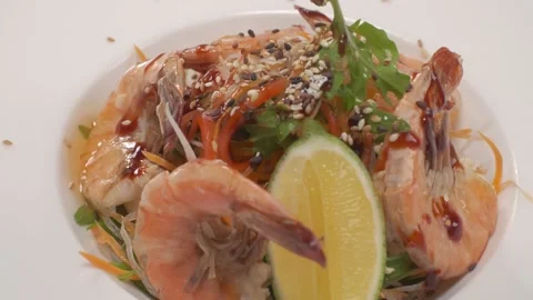 A dish with ready-made red fish, cucumbers, lemon, onions Stock Footage 221463476