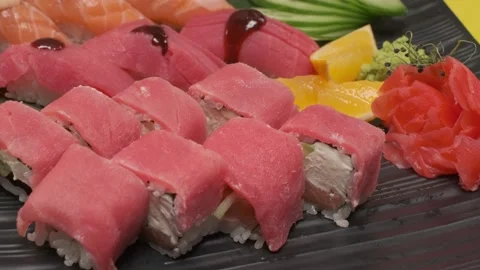 A dish with ready-made red fish, cucumbers, lemon, onions Stock Footage 237852924