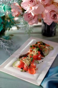 Dish on a rectangular plate on the wedding table Stock Photos