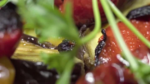 A dish of red and green pepper, eggplant, baked in the oven and decorated wit Stock Footage 156820549