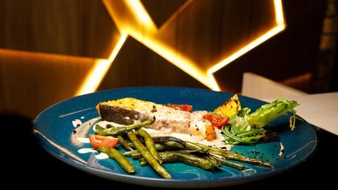 Dish red fish and vegetables Stock Photos