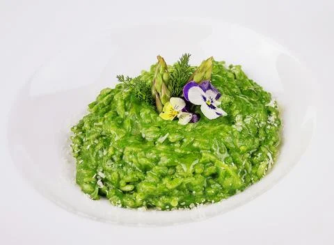 Dish of risotto with asparagus closeup Stock Photos