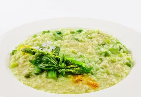 Dish of risotto with asparagus isolated on white plane Stock Photos