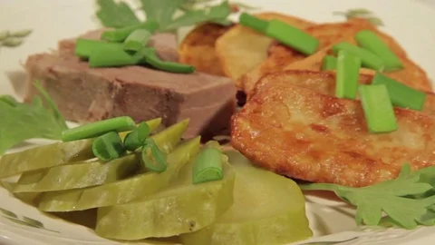 A dish of roasted potatoes with meat Stock Footage 70926187