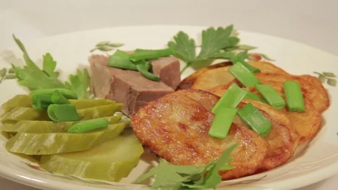 A dish of roasted potatoes with meat Stock Footage 70926203