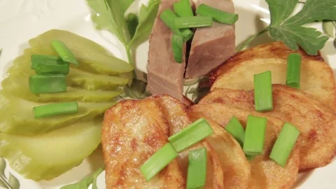 A dish of roasted potatoes with meat Stock Footage 70926330