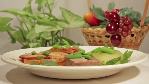 A dish of roasted potatoes with meat Stock Footage 70926433
