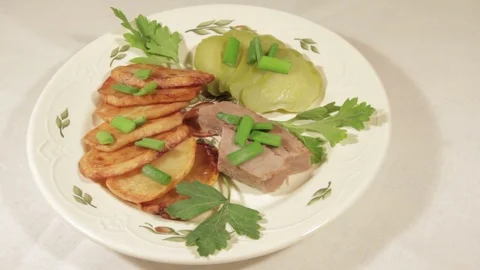 A dish of roasted potatoes with meat Stock Footage 70926461